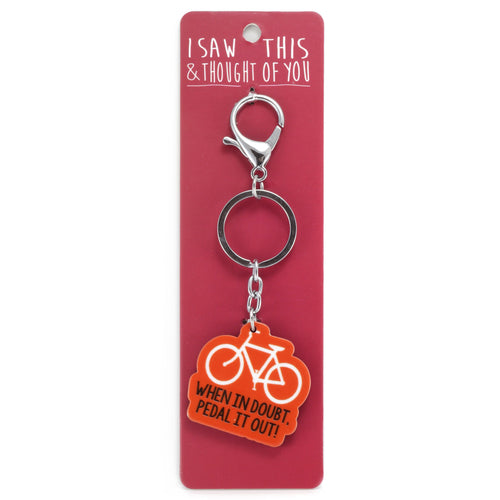 A KEYRING SAYING 'PEDAL IT OUT'