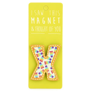 A fridge magnet saying 'X'