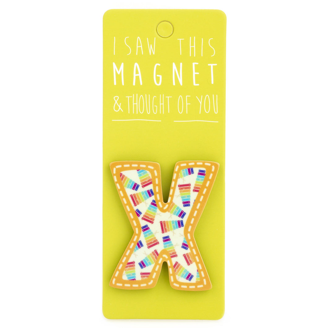 A fridge magnet saying 'X'