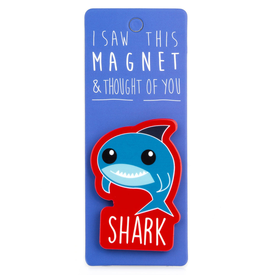 A fridge magnet saying 'Shark'