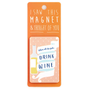 A fridge magnet saying 'Drink Wine'