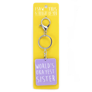 A KEYRING SAYING 'OKAYEST SISTER'